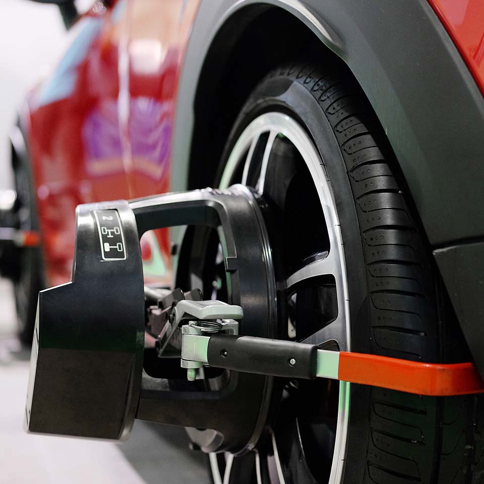 Wheel alignment equipment on a car wheel